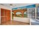 Bedroom with mural art on the walls, wood-look flooring and a large window view at 1000 Manigan Ave, Oviedo, FL 32765