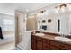 Bathroom featuring double sinks, a glass shower, and a soaking tub at 2129 Victoria Glen Dr, Sanford, FL 32773