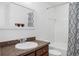 Bright bathroom with a large mirror and shower with stylish curtain at 2129 Victoria Glen Dr, Sanford, FL 32773