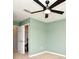 Bedroom features neutral carpet, a ceiling fan, and sage-green walls at 2129 Victoria Glen Dr, Sanford, FL 32773