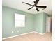 Bedroom features neutral carpet, a ceiling fan, and a window at 2129 Victoria Glen Dr, Sanford, FL 32773