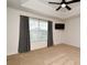 Spacious bedroom featuring a large window, neutral carpet, and ceiling fan at 2129 Victoria Glen Dr, Sanford, FL 32773