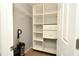 Well-organized closet featuring shelves, drawers, and a wire basket at 2129 Victoria Glen Dr, Sanford, FL 32773