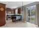 Bright kitchen with stainless steel appliances, dark wood cabinetry, and a breakfast bar with blue chairs at 2129 Victoria Glen Dr, Sanford, FL 32773