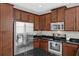 Modern kitchen with stainless steel appliances, dark granite countertops, and beautiful cabinetry at 2129 Victoria Glen Dr, Sanford, FL 32773