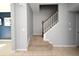 Bright interior view of the carpeted staircase with white railings and a wood banister at 2129 Victoria Glen Dr, Sanford, FL 32773