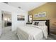 Comfortable bedroom showcases a decorative wall, neutral tones, and a serene atmosphere for relaxation at 5538 Stockade Blvd, Saint Cloud, FL 34771