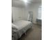 Well-lit bedroom with a queen bed and double doors to closet at 1241 Melontree Ct # 6, Gotha, FL 34734