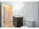 Modern bathroom featuring a dark vanity with a shower and tub combo in the background at 1740 Palm Rd, Ormond Beach, FL 32174