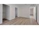 Bedroom with light wood flooring and a doorway leading to the bathroom and closet at 1740 Palm Rd, Ormond Beach, FL 32174