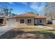 Newly constructed tan house with a white garage door and landscaped lawn at 1740 Palm Rd, Ormond Beach, FL 32174