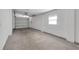 Garage with concrete floor and overhead door at 1740 Palm Rd, Ormond Beach, FL 32174