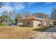 View of the back of a cozy home, showing the outdoor space and simple architectural design at 1740 Palm Rd, Ormond Beach, FL 32174