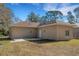 Exterior rear view of the house with the backyard space at 1740 Palm Rd, Ormond Beach, FL 32174