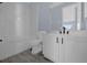 Modern bathroom with white cabinets and marble tile at 3814 Golden Feather Way, Kissimmee, FL 34746