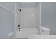 Clean bathroom with white tile and modern fixtures at 3814 Golden Feather Way, Kissimmee, FL 34746