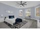 Main bedroom with bay window and ceiling fan at 3814 Golden Feather Way, Kissimmee, FL 34746