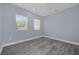 Bright bedroom with wood-look floors and neutral walls at 3814 Golden Feather Way, Kissimmee, FL 34746