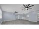 Open loft area featuring hardwood floors and ceiling fans at 3814 Golden Feather Way, Kissimmee, FL 34746