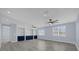 Spacious loft area with built-in shelving and hardwood floors at 3814 Golden Feather Way, Kissimmee, FL 34746