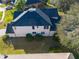 Aerial view of the home's rear, highlighting the roofline and landscaping at 4431 Rock Hill Loop, Apopka, FL 32712