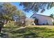 Fenced backyard featuring an enclosed porch and manicured lawn at 4431 Rock Hill Loop, Apopka, FL 32712