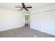 Inviting bedroom showcasing a ceiling fan, closet, and serene neutral paint for a calming ambiance at 4431 Rock Hill Loop, Apopka, FL 32712