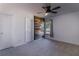 Cozy bedroom with wood accent wall and ceiling fan at 4431 Rock Hill Loop, Apopka, FL 32712