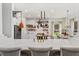 Kitchen island with white quartz countertop and gold fixtures at 4431 Rock Hill Loop, Apopka, FL 32712