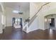 Two-story living room with hardwood floors and a view of the pool at 4431 Rock Hill Loop, Apopka, FL 32712