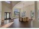 Bright, large living room with soaring ceilings, transom windows, and wood floors at 4431 Rock Hill Loop, Apopka, FL 32712