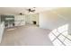 Second floor loft featuring carpet, desk nook, and stairwell at 4431 Rock Hill Loop, Apopka, FL 32712