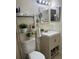 Bright bathroom with vanity, decorative shelving, and good lighting at 606 Northlake Dr # 606, Sanford, FL 32773