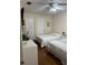 Inviting bedroom with two beds, a ceiling fan, and light-colored walls at 606 Northlake Dr # 606, Sanford, FL 32773