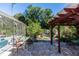 Backyard featuring a covered patio and outdoor seating, creating a cozy space for enjoying the outdoors and a pool at 1269 Buccaneer Ave, Deltona, FL 32725