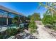Backyard view featuring a fenced-in screened pool and patio perfect for entertaining and gardening at 1269 Buccaneer Ave, Deltona, FL 32725