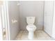 A bathroom with a white toilet and tiled flooring at 1269 Buccaneer Ave, Deltona, FL 32725