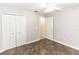 Bedroom with large closet, fan and view to another room through an open door at 1269 Buccaneer Ave, Deltona, FL 32725