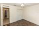 Spacious bedroom featuring a ceiling fan, closet, and stylish marbled floors, offering a comfortable living space at 1269 Buccaneer Ave, Deltona, FL 32725