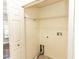 An empty closet with wire shelving ready to store your belongings, next to a washer hookup, very useful for the laundry at 1269 Buccaneer Ave, Deltona, FL 32725