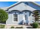 Charming single-story home with blue exterior, white trim, and landscaping at 1269 Buccaneer Ave, Deltona, FL 32725