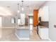 Open kitchen with granite countertops, stainless appliances, and views to the breakfast nook at 1269 Buccaneer Ave, Deltona, FL 32725