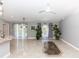 Spacious living room with tile floors, garden views, and access to the pool area at 1269 Buccaneer Ave, Deltona, FL 32725
