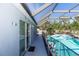 Screened pool area, showcasing the pool, and a sliding door entrance to the home at 1269 Buccaneer Ave, Deltona, FL 32725