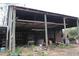 Interior view of a barn, filled with tools and equipment, showcasing storage possibilities at 3555 E Johnson Ave, Haines City, FL 33844