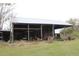 A large metal roofed barn sits on a grassy lot at 3555 E Johnson Ave, Haines City, FL 33844