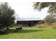 View of barn with farm equipment and various tools at 3555 E Johnson Ave, Haines City, FL 33844
