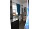 Cozy bathroom with a vanity, toilet, and tiled walls, with a window providing light at 3555 E Johnson Ave, Haines City, FL 33844