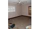 Tile-floored bedroom featuring a bright window with shutters and lots of natural light at 3555 E Johnson Ave, Haines City, FL 33844