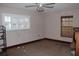 Empty bedroom with white shuttered window, tile flooring, and minimal decor at 3555 E Johnson Ave, Haines City, FL 33844